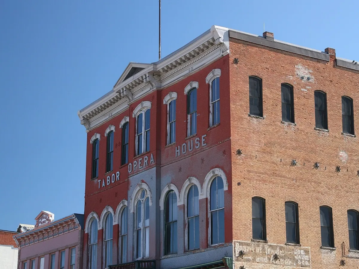 The red-brick Tabor Opera House on Harrison Avenue in Leadville, its name painted across the front, in June 2010